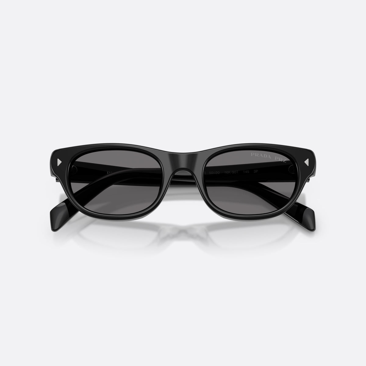 Prada PR C08S 16K90T sunglasses, black cat eye frame for women, keyhole bridge, brand lettering on temples, full-rim frame, folded