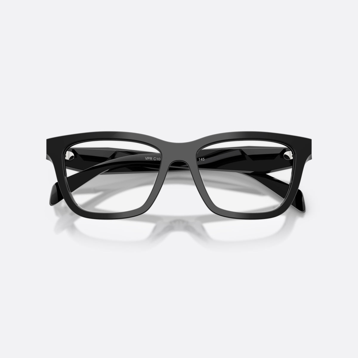 Prada PR C10V 16K1O1 eyeglasses, black butterfly frame for women, plain bridge, brand lettering on temples, full-rim frame, folded