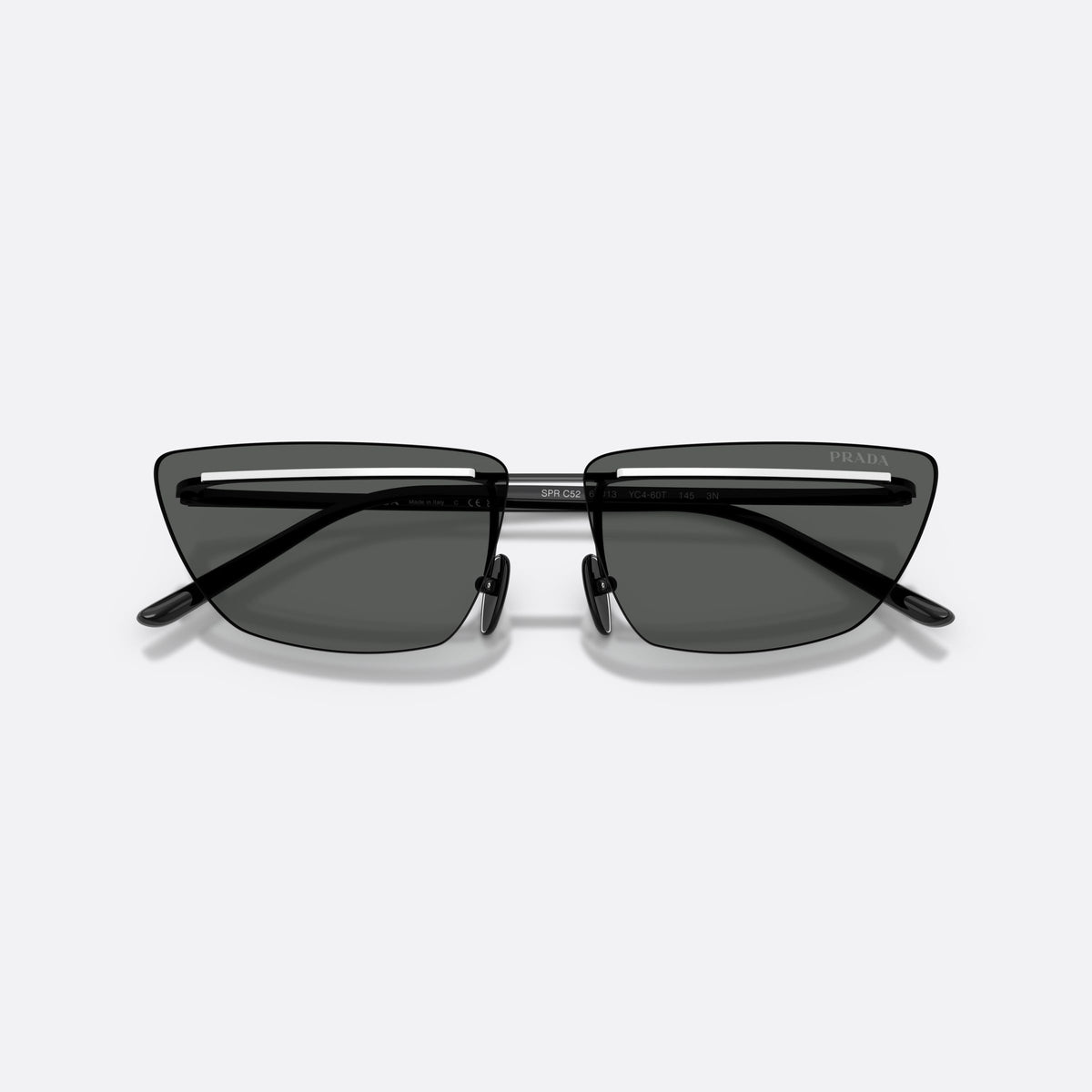 Prada PR C52S YC460T sunglasses, black butterfly frame for women, thin metal bridge, brand lettering on temples, folded