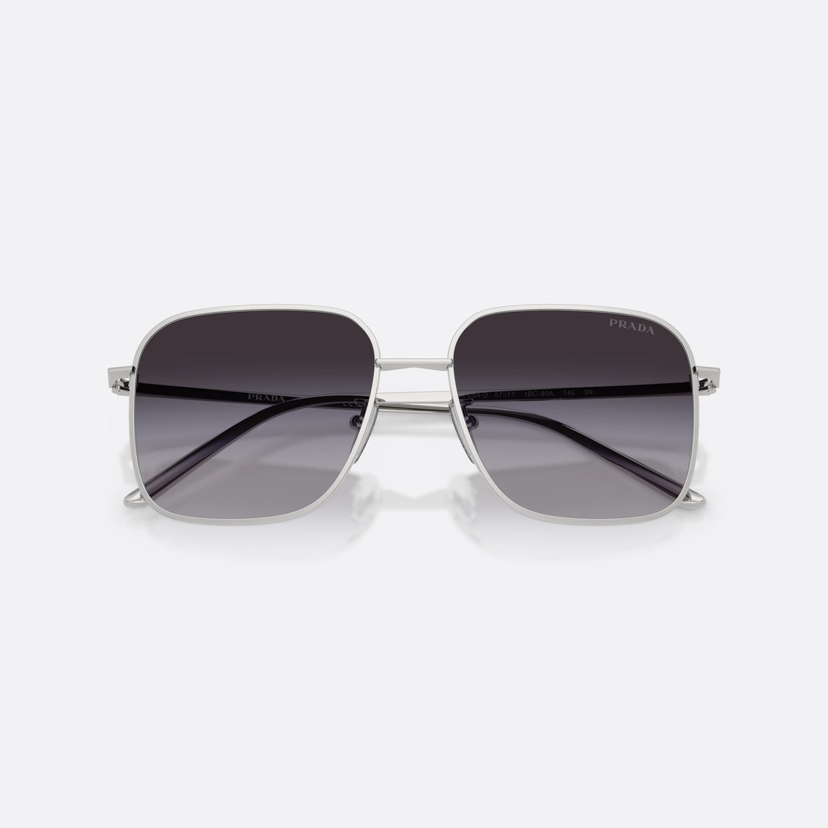 Prada PR C54SD 1BC90A sunglasses, silver square frame for women, plain metal bridge, brand lettering on temples, folded