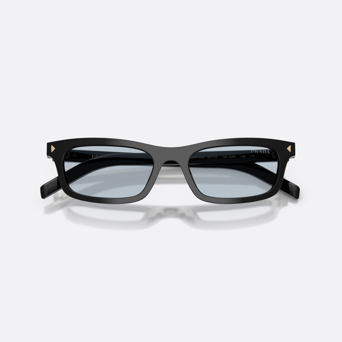 Prada PR D05S 16K30W sunglasses, black pillow frame for women, plain bridge, brand lettering on temples, full rim, folded