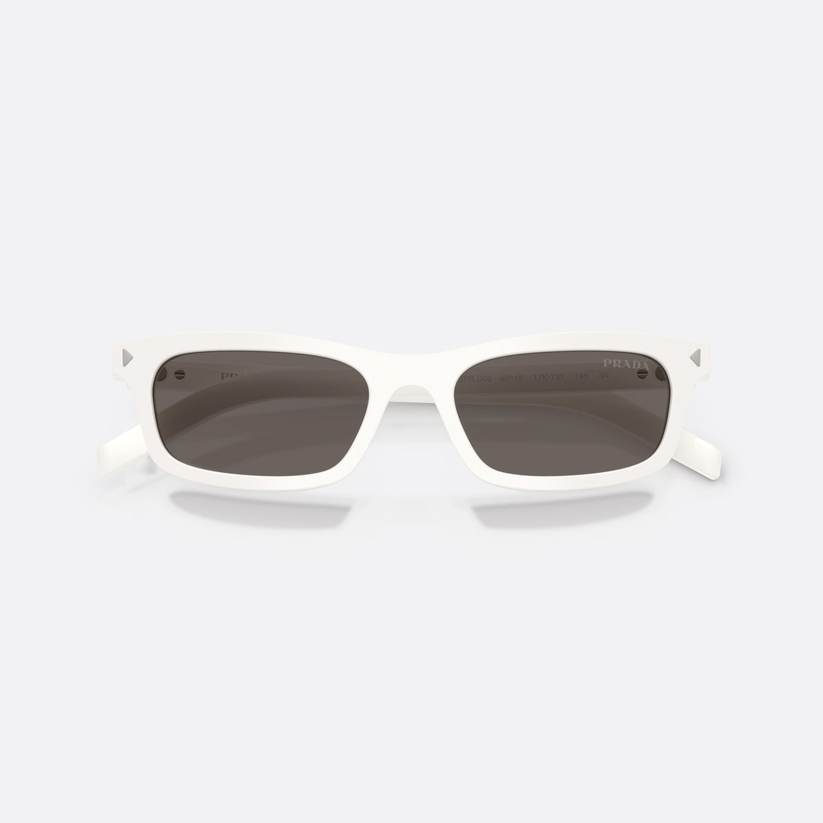 Prada PR D05S 17K731 sunglasses, white pillow frame for women, plain bridge, integrated design, brand lettering on temple, folded