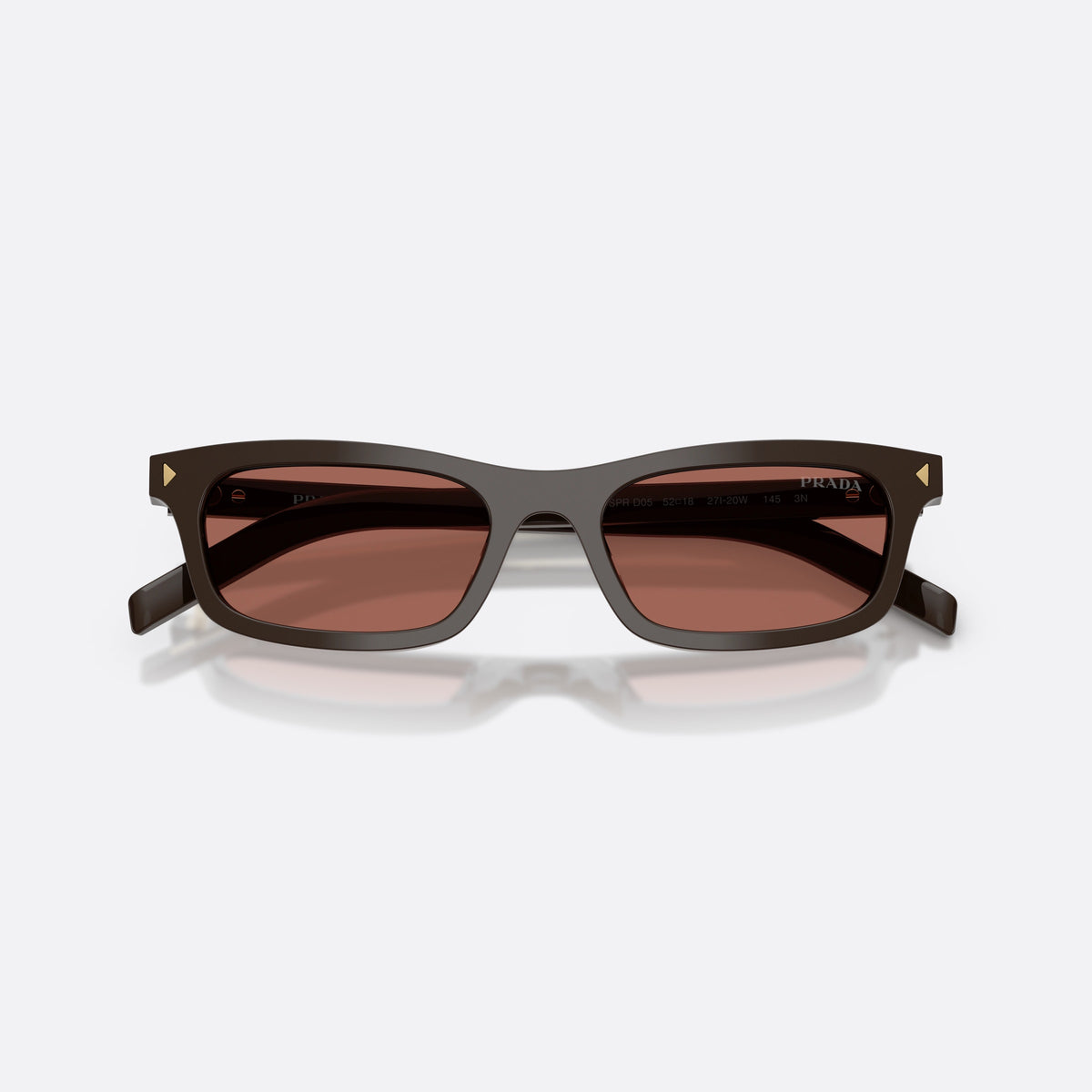 Prada PR D05S 27I20W sunglasses, brown pillow frame for women, plain integrated bridge, brand lettering on temples, folded
