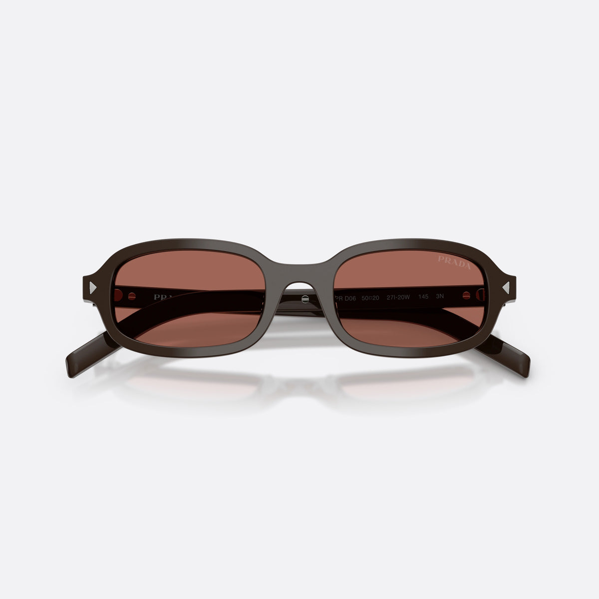 Prada PR D06S 27I20W sunglasses, brown oval frame for women, plain bridge, brand logo on temple, full-rim frame, folded