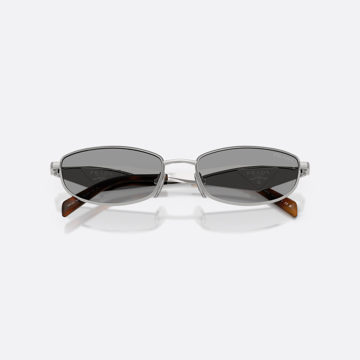 Prada PR D51S 1BC50Q sunglasses, silver oval frame for women, plain metal bridge, brand logo on temples, folded