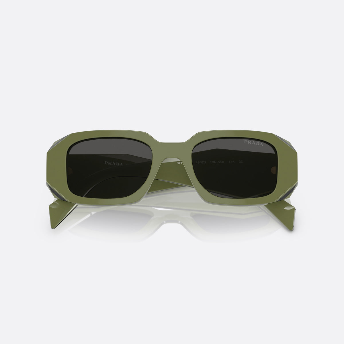 Prada Symbole PR 17WS 13N-5S0 sunglasses, green geometric frame for women, plain integrated bridge, brand lettering on temples, folded