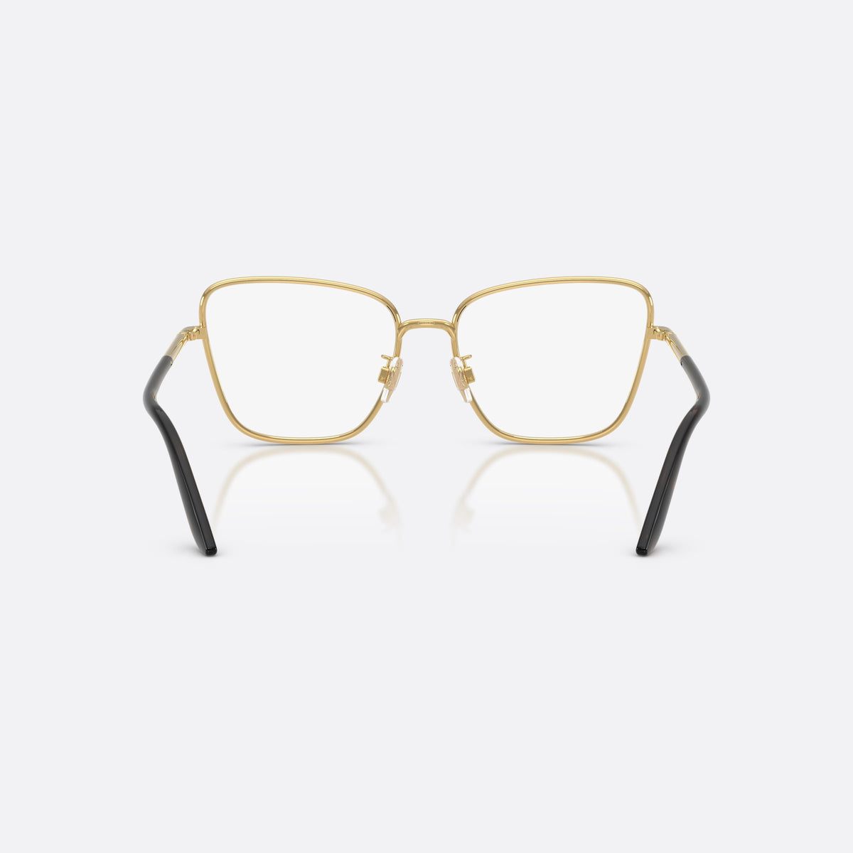 Dolce & Gabbana DG1359 02 eyeglasses, gold cat eye frame for women, plain metal bridge, brand lettering on temples, back view