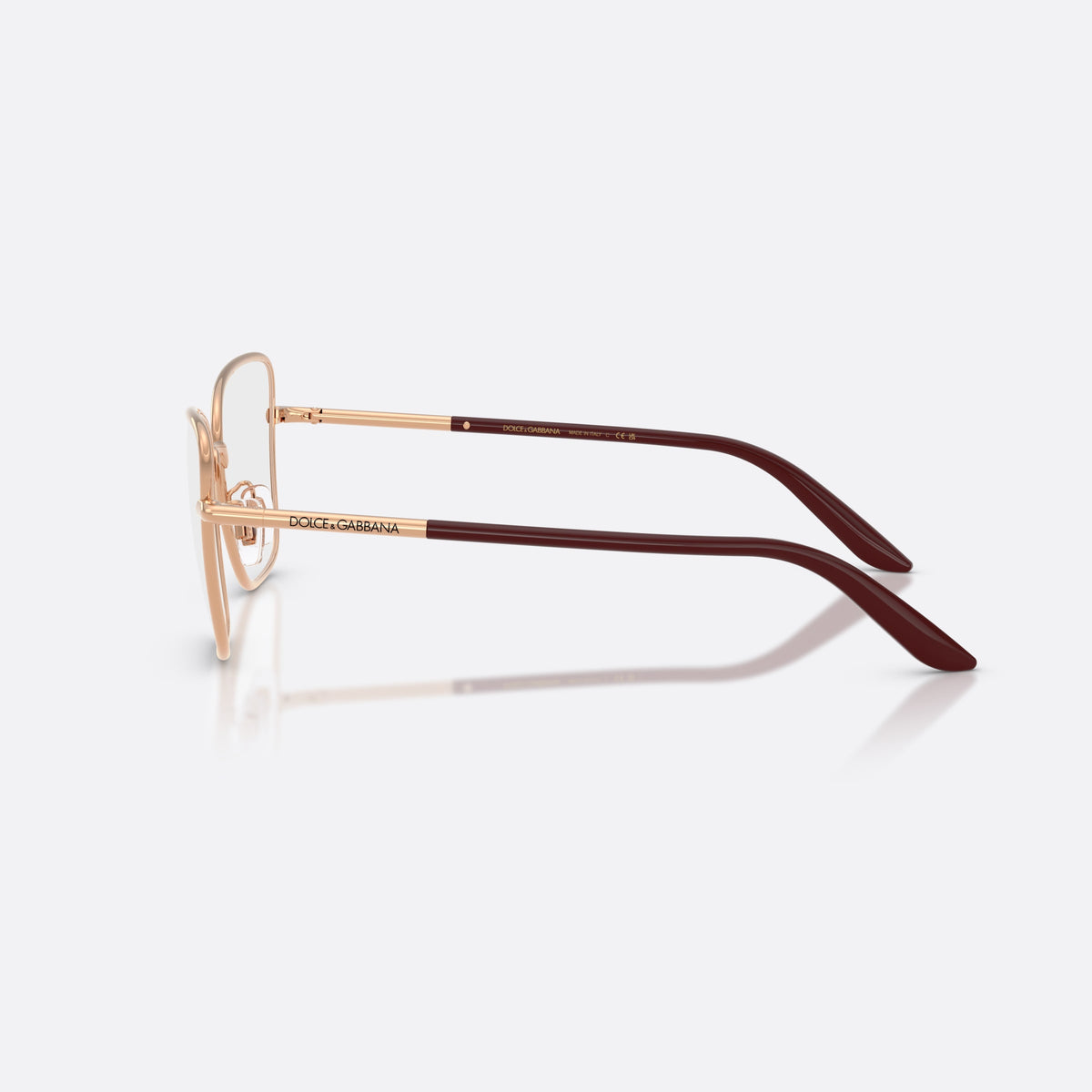 Dolce & Gabbana DG1359 1298 eyeglasses, gold cat eye frame for women, plain metal bridge, brand lettering on temples, side view