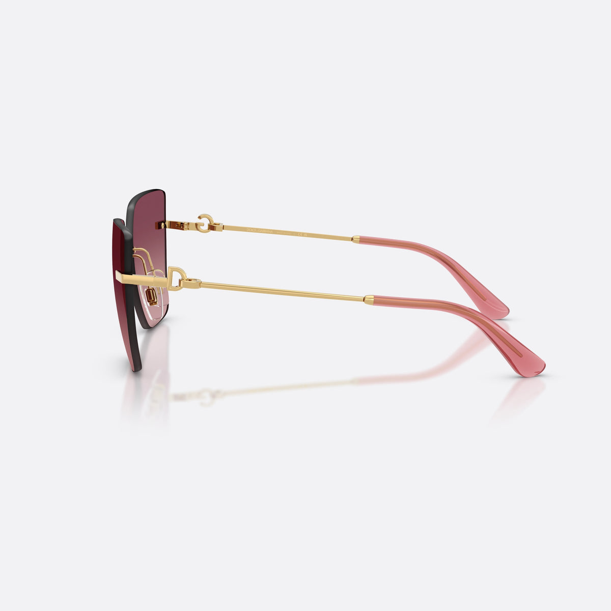 Dolce & Gabbana DG2321 02/8D sunglasses, gold cat eye frame for women, plain metal bridge, brand logo on temples, rimless frame, side view