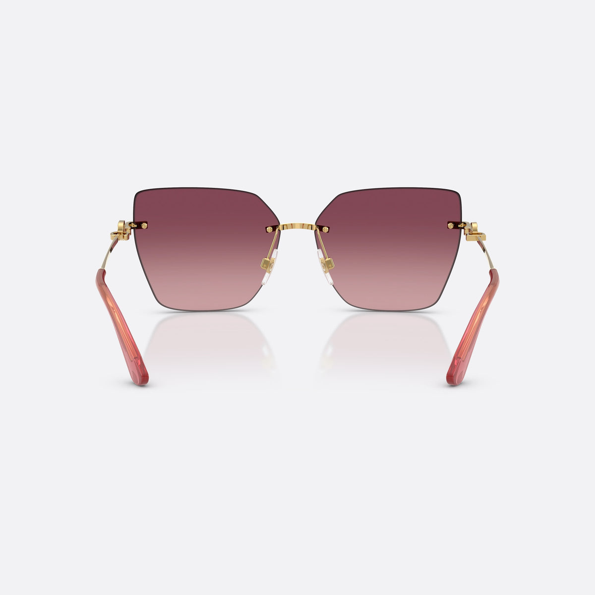 Dolce & Gabbana DG2321 02/8D sunglasses, gold cat eye frame for women, plain metal bridge, brand logo on temples, rimless frame, back view
