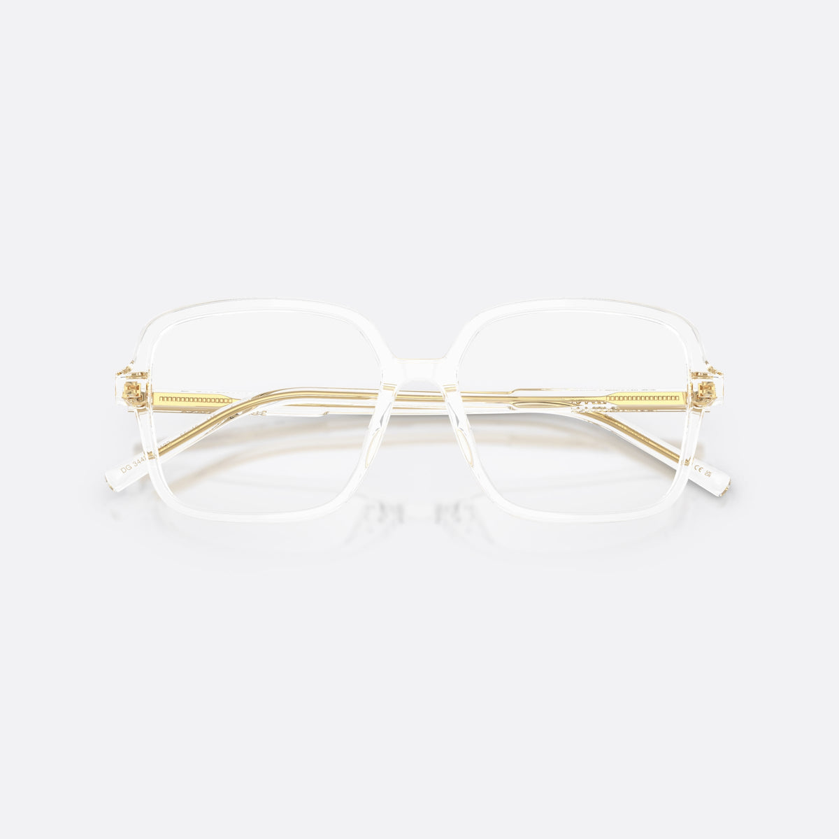 Dolce & Gabbana DG3442 3133 eyeglasses, clear square frame for women, plain integrated bridge, brand lettering on temples, folded