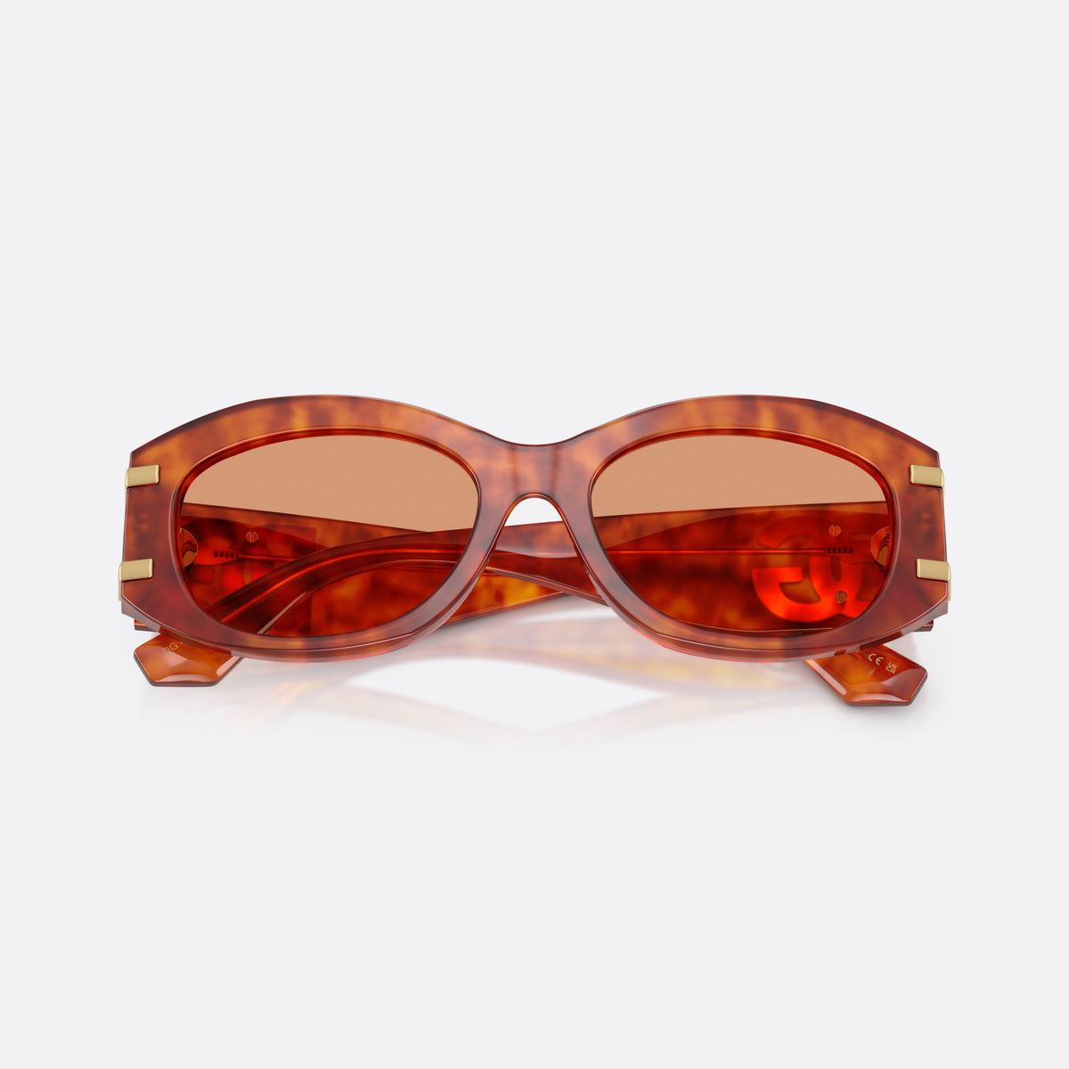 Dolce & Gabbana DG4502 3452/7 sunglasses, brown oval frame for women, plain integrated bridge, brand logo plaque on temple, folded