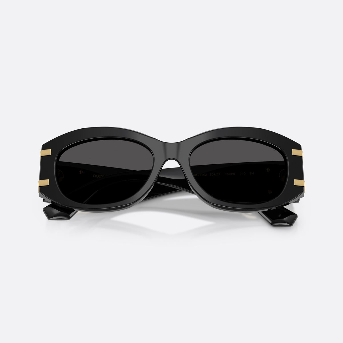 Dolce & Gabbana DG4502 501/87 sunglasses, black oval frame for women, plain bridge, brand logo on temple, full-rim frame, folded