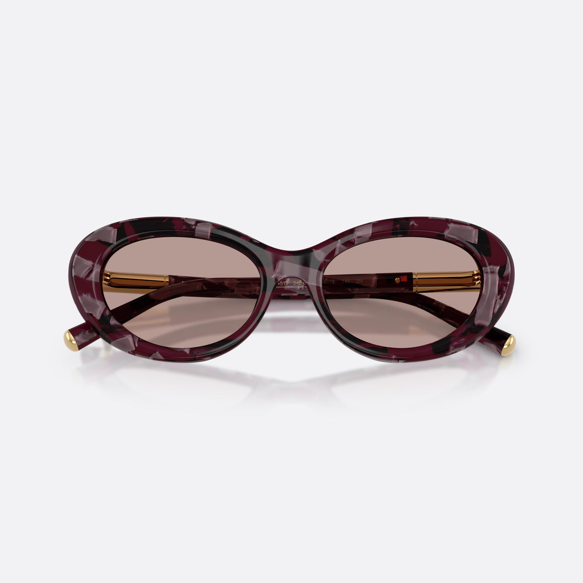 Dolce & Gabbana DG4519 34647N sunglasses, violet oval frame for women, plain bridge, brand lettering on temple, gold-tone hinges, folded