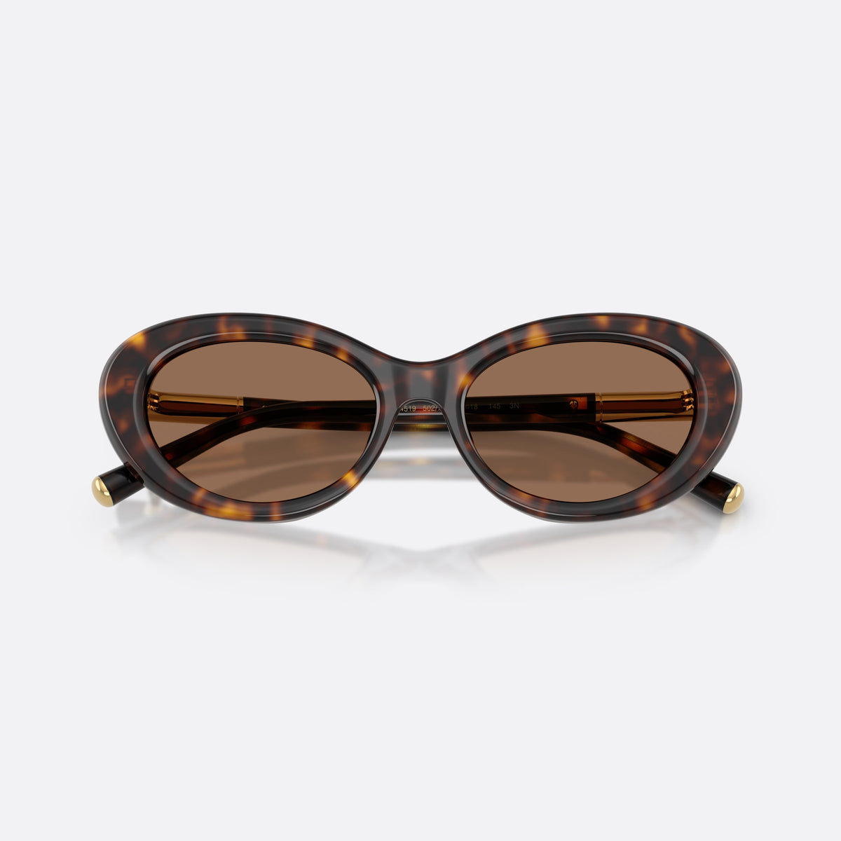 Dolce & Gabbana DG4519 502/73 sunglasses, havana oval frame for women, plain bridge, brand lettering on temple, full rim frame, folded
