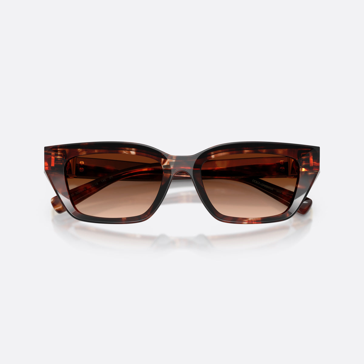 Dolce & Gabbana DG4532 322274 sunglasses, red cat eye frame for women, plain bridge, brand lettering on temples, full-rim frame, folded
