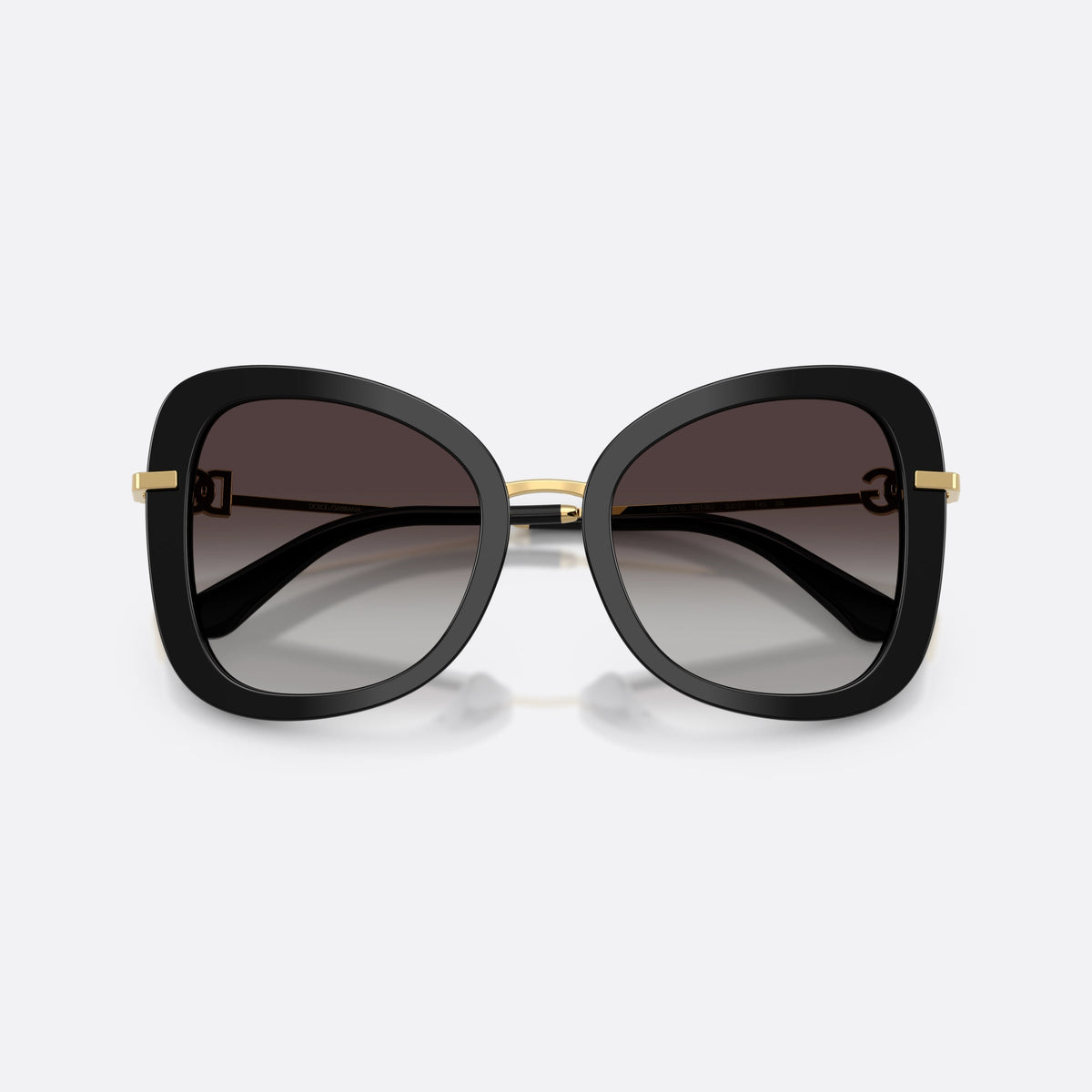Dolce & Gabbana DG4535 501/8G sunglasses, black butterfly frame for women, metal bridge with gold-tone finish, gradient tinted lenses, folded