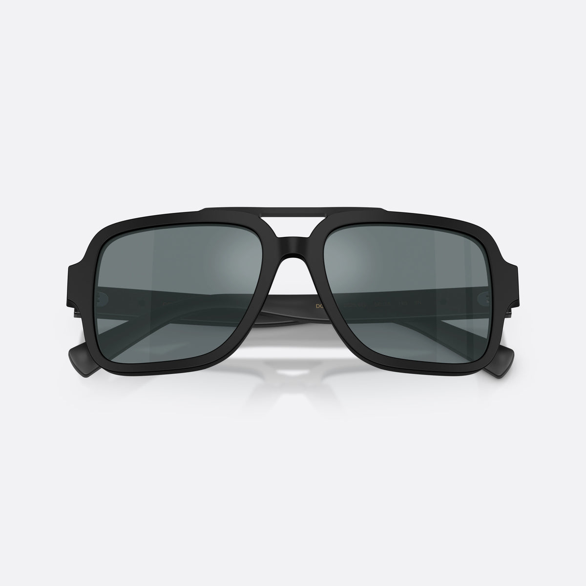 Dolce & Gabbana DG4544 25256G sunglasses, black pilot frame for men, double bridge with top bar, brand lettering on the temple, folded