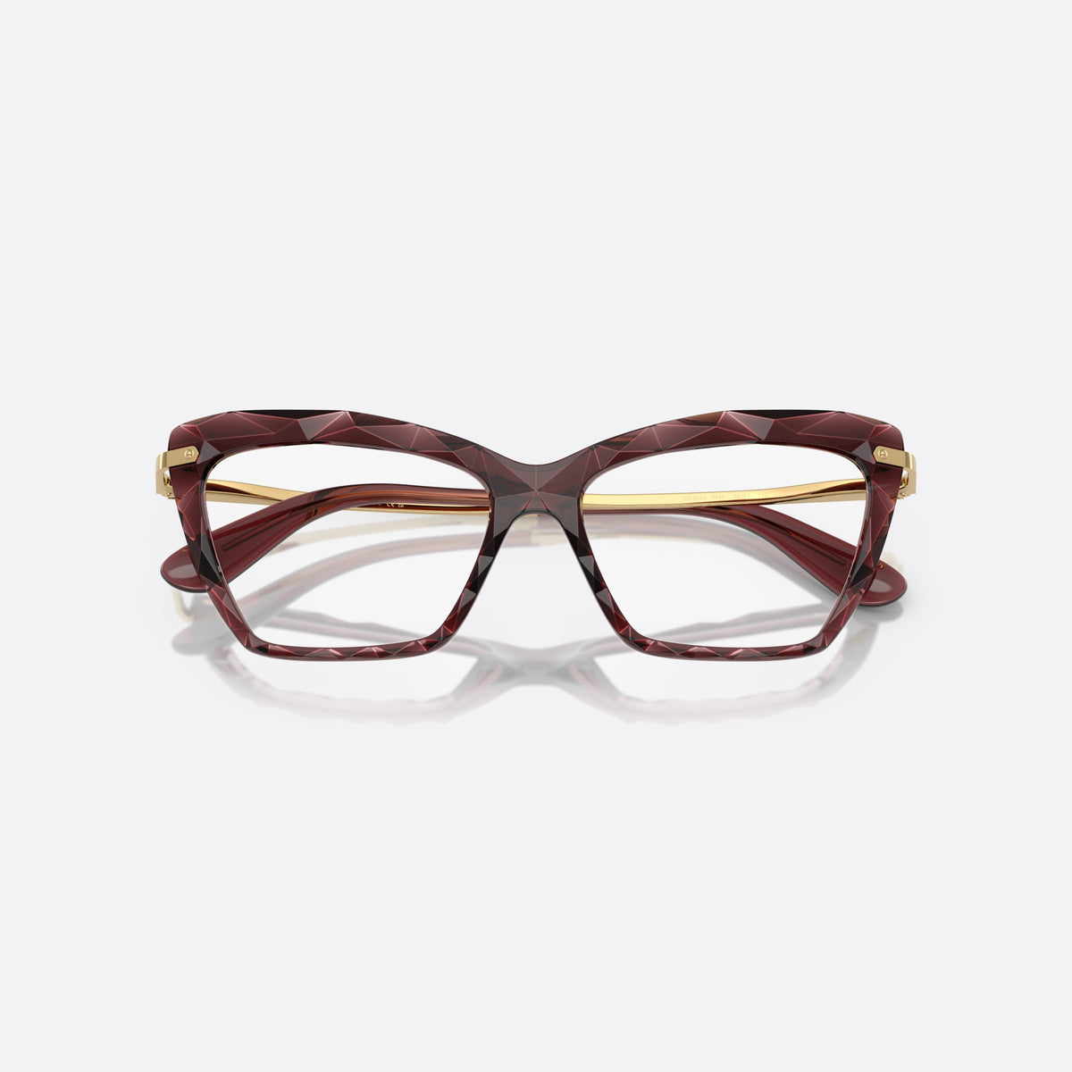 Dolce & Gabbana DG5025 3045 eyeglasses, red cat eye frame for women, plain double-arch bridge, brand lettering on temples, folded