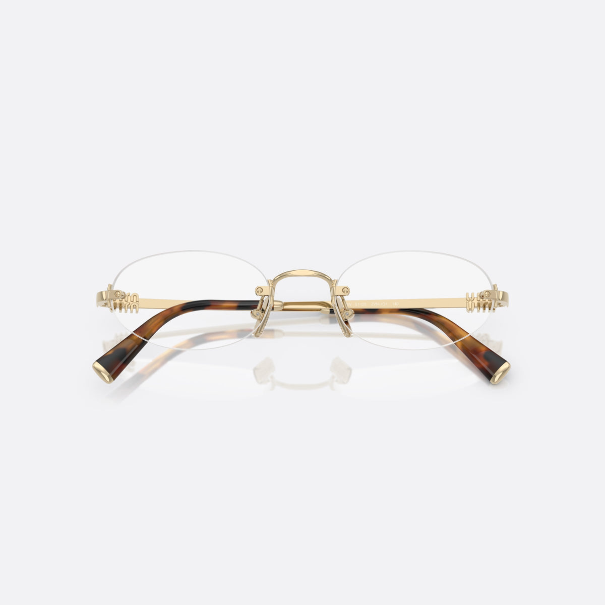 Miu Miu 0MU 53WV ZVN1O1 eyeglasses, gold oval frame for women, metal bridge with slim profile, metal hinges, folded