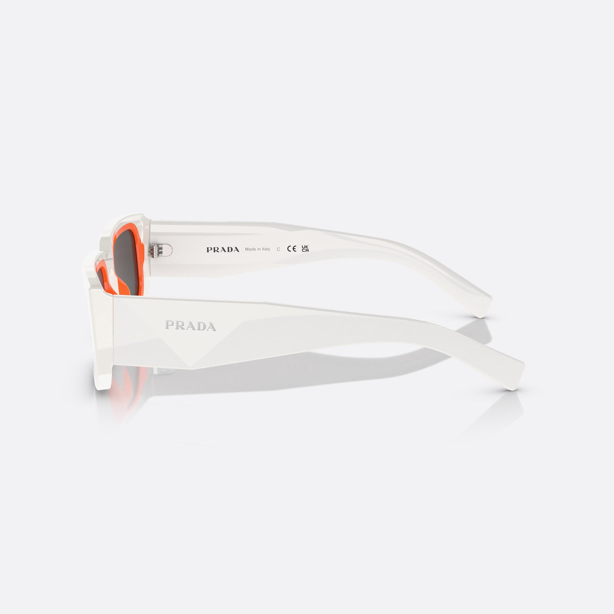 Prada PR 06YS 06YS sunglasses, white rectangle frame, unisex, plain bridge, integrated frame, wide temples, tapered ends, side view