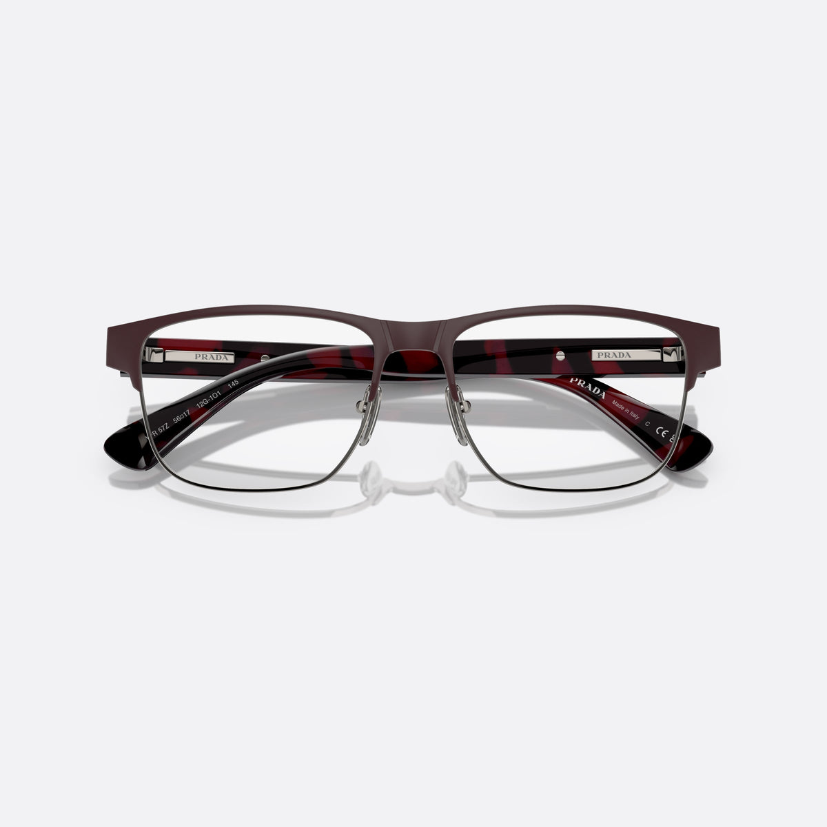 Prada PR 57ZV 12G1O1 eyeglasses, brown pillow frame for men, saddle-style metal bridge, brand lettering on the temples, folded