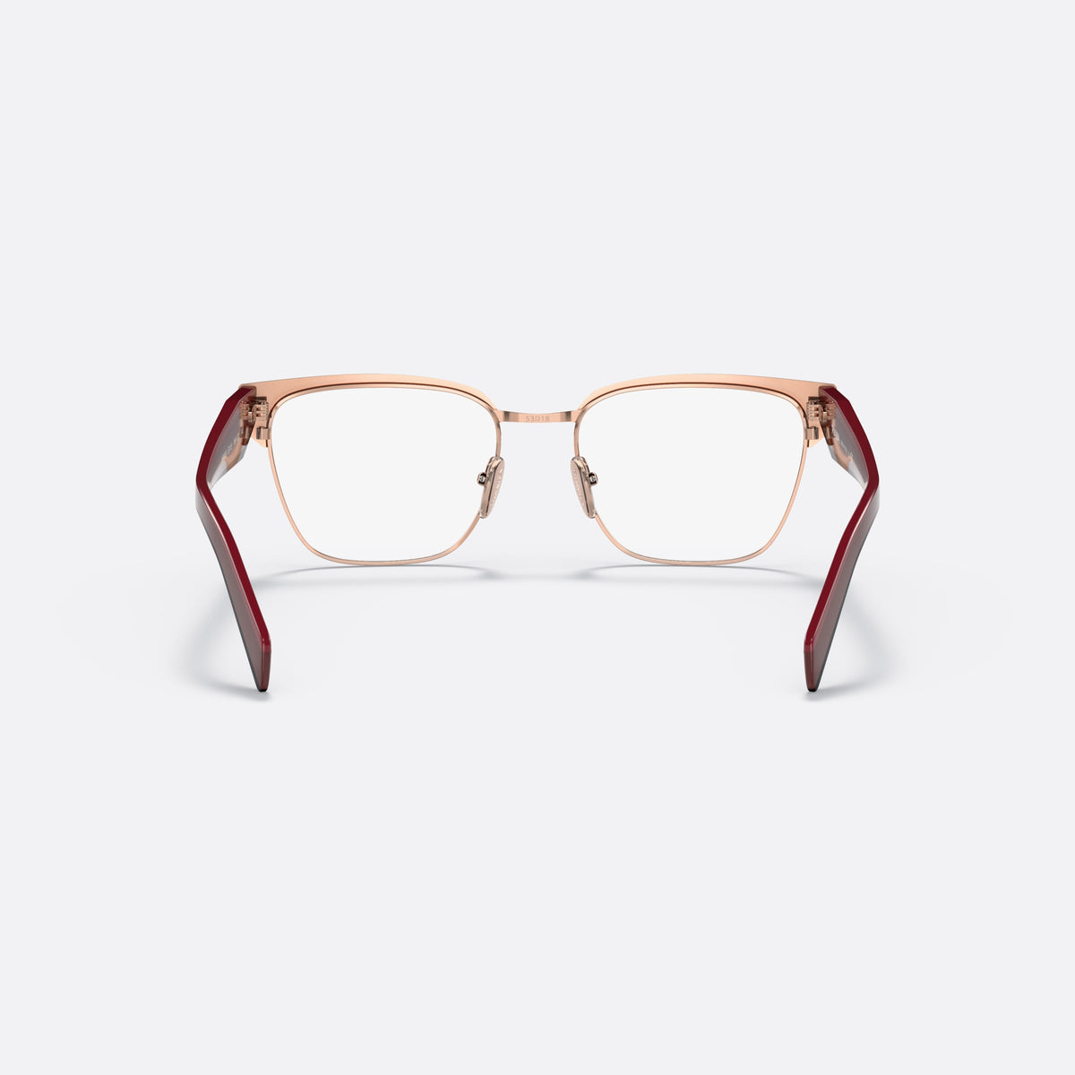 Prada PR 65YV 16A1O1 eyeglasses, red irregular frame for women, saddle-style metal bridge, brand lettering on the temples, back view