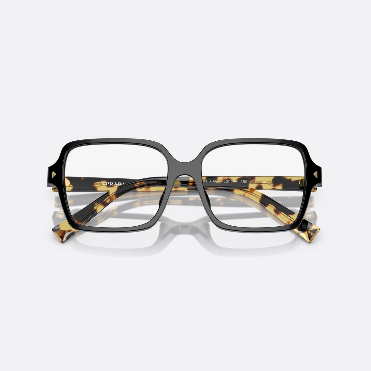 Prada PR A02V 389-1O1 A eyeglasses, black geometric frame for women, keyhole bridge, brand lettering on the temples, folded