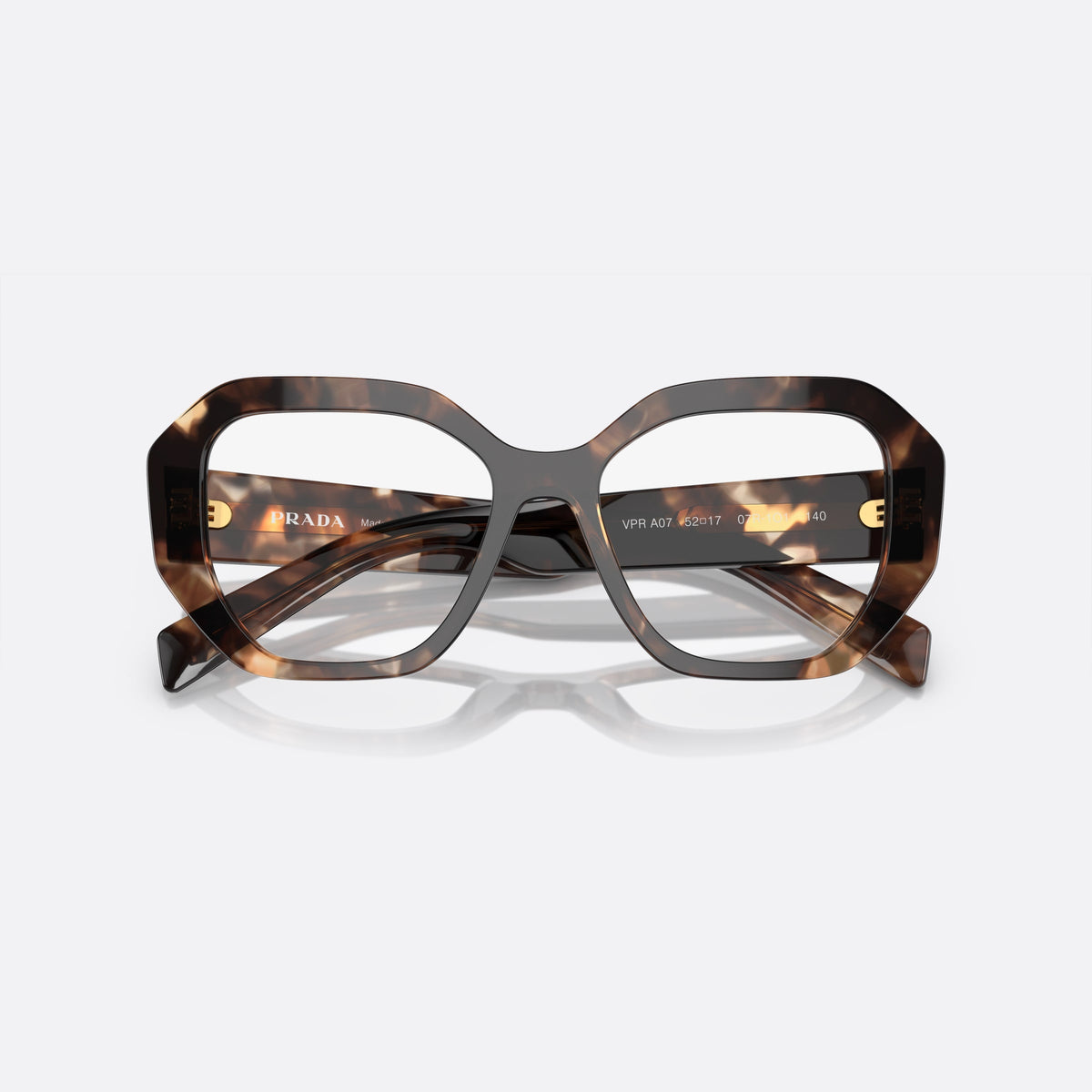 Prada PR A07V 07R-1O1 D eyeglasses, havana geometric frame for women, plain bridge, brand lettering on temples, full-rim frame, folded