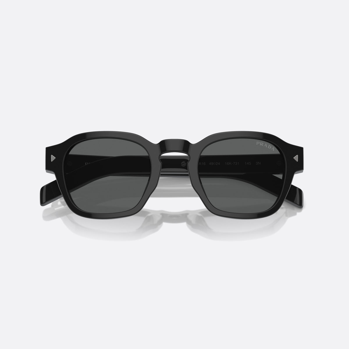 Prada PR A16S 52 sunglasses, black phantos frame for men, brand lettering on temples, wide temples with stripe, folded