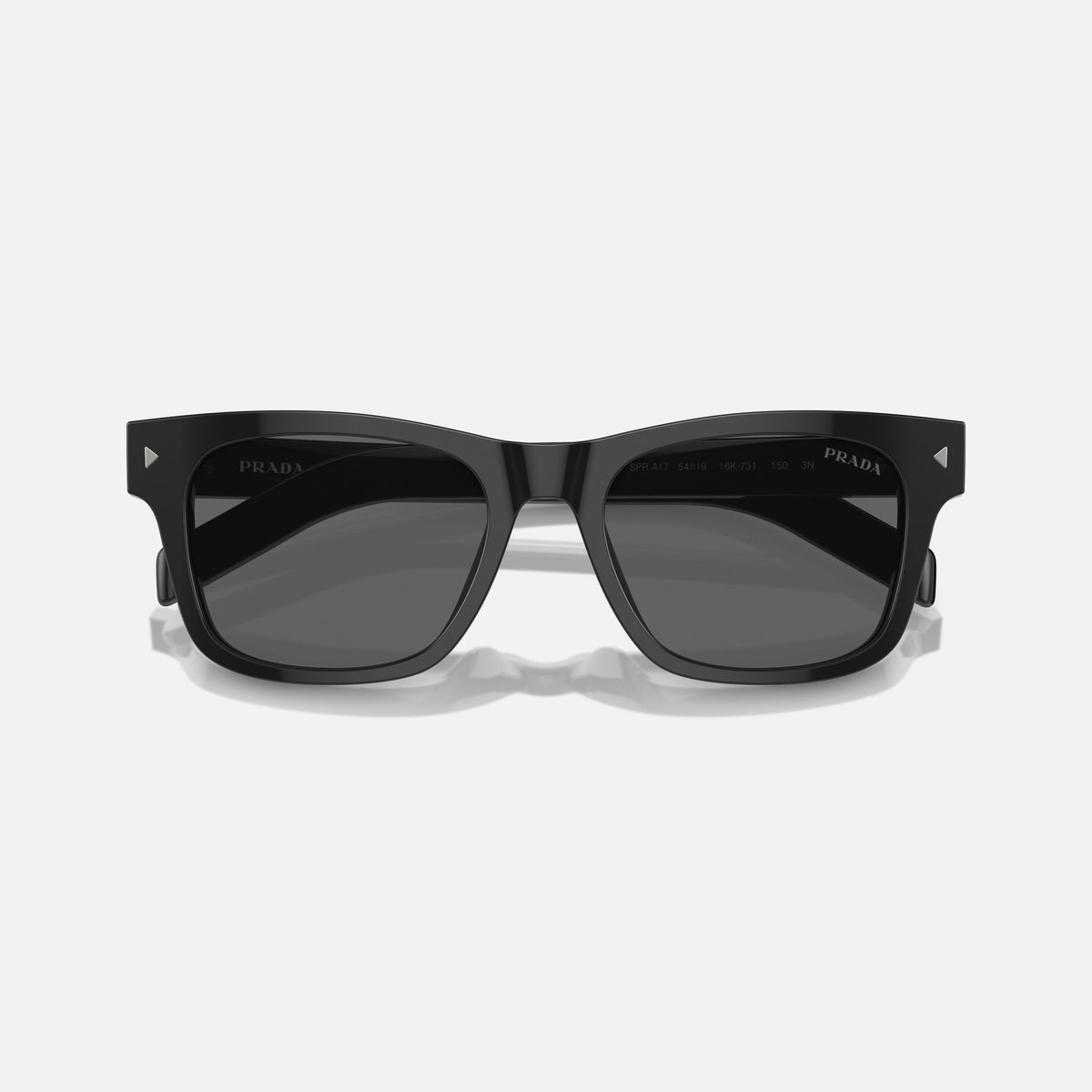 Prada PR A17S 16K731 sunglasses, black rectangle frame for men, plain bridge, brand lettering on temple, full-rim frame, folded