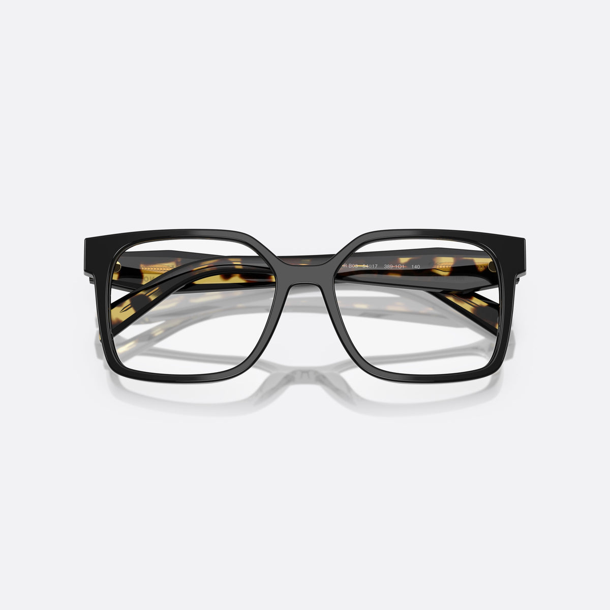 Prada PR B03V 3891O1 eyeglasses, black rectangle frame for women, plain integrated bridge, brand lettering on the temples, folded