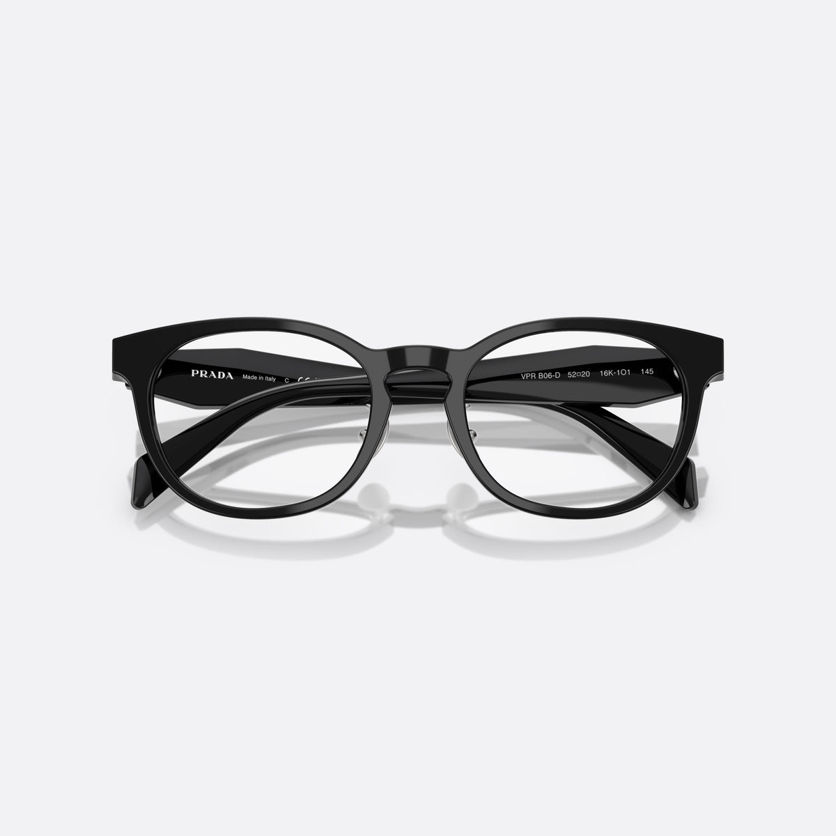 Prada PR B06VD 16K1O1 eyeglasses, black visor frame for women, keyhole bridge, brand lettering on temples, full-rim frame, folded