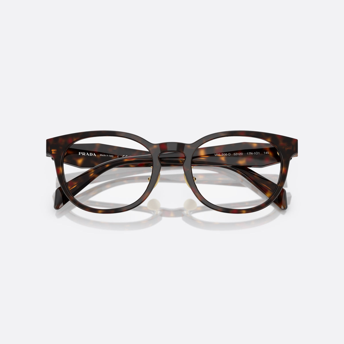 Prada PR B06VD 17N1O1 eyeglasses, havana visor frame for women, plain combined bridge, brand lettering on temples, folded