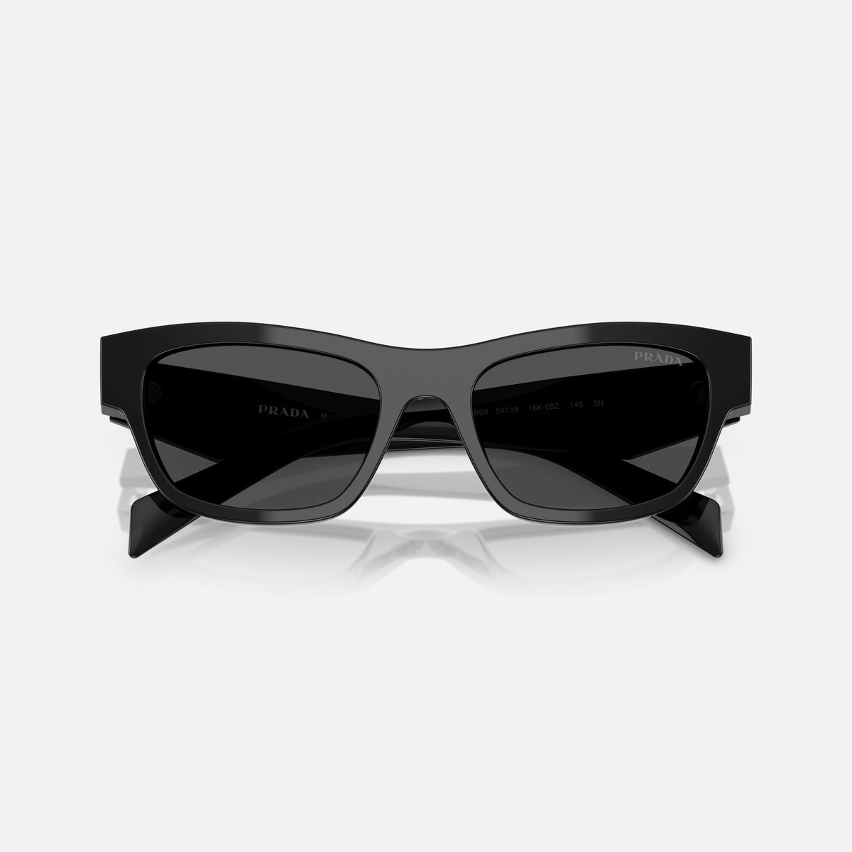 Prada PR B09S 16K08Z sunglasses, black butterfly frame for women, plain double bridge, brand logo on temple plaque, folded