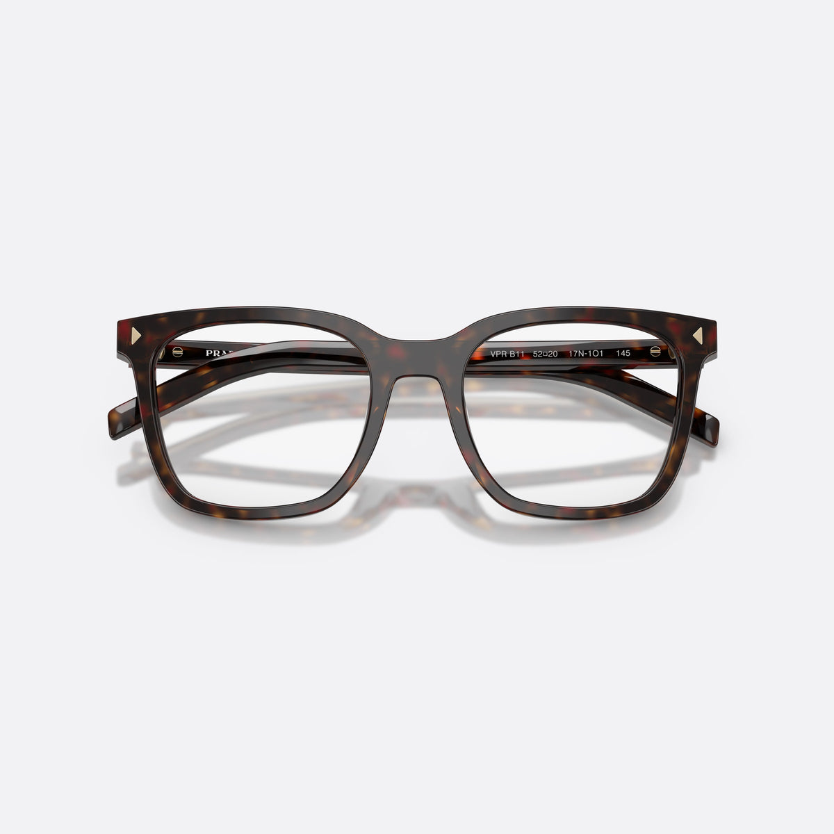 Prada PR B11V 17N1O1 eyeglasses, havana pillow frame for women, plain bridge, brand lettering on temples, full-rim frame, folded