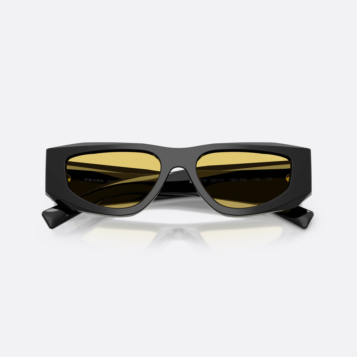 Prada PR B19S 16K455 sunglasses, black pillow frame for men, plain integrated bridge, brand lettering on temples, folded