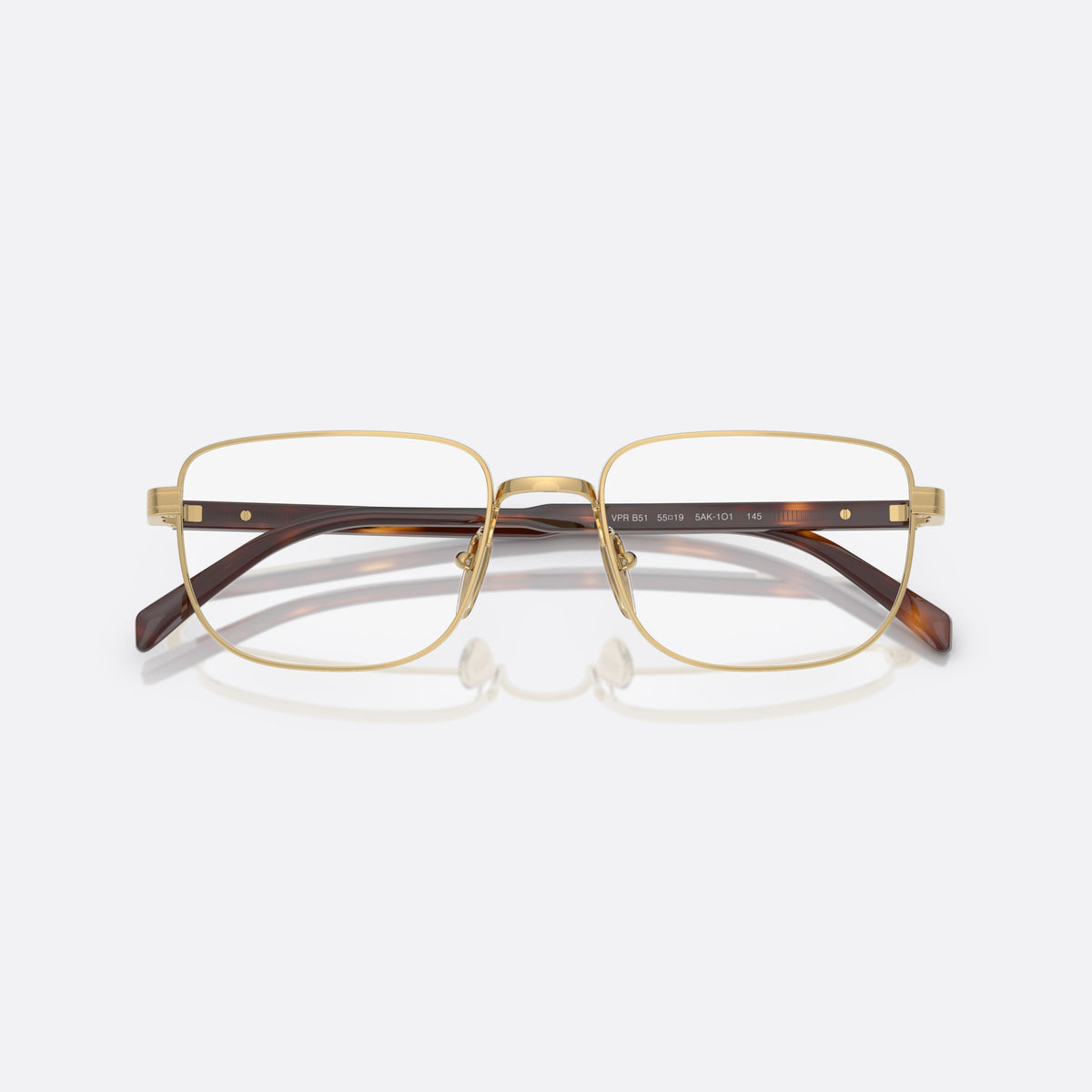 Prada PR B51V 5AK1O1 eyeglasses, gold geometric frame for men, plain metal bridge, brand lettering on temples, folded