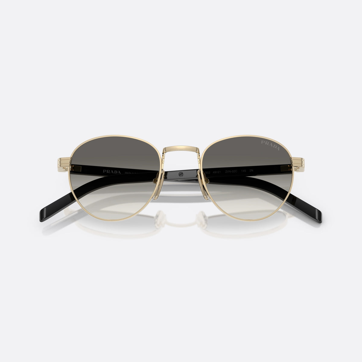 Prada PR B52S ZVN02C GLGR sunglasses, gold oval frame for women, plain metal bridge, brand lettering on temples, folded