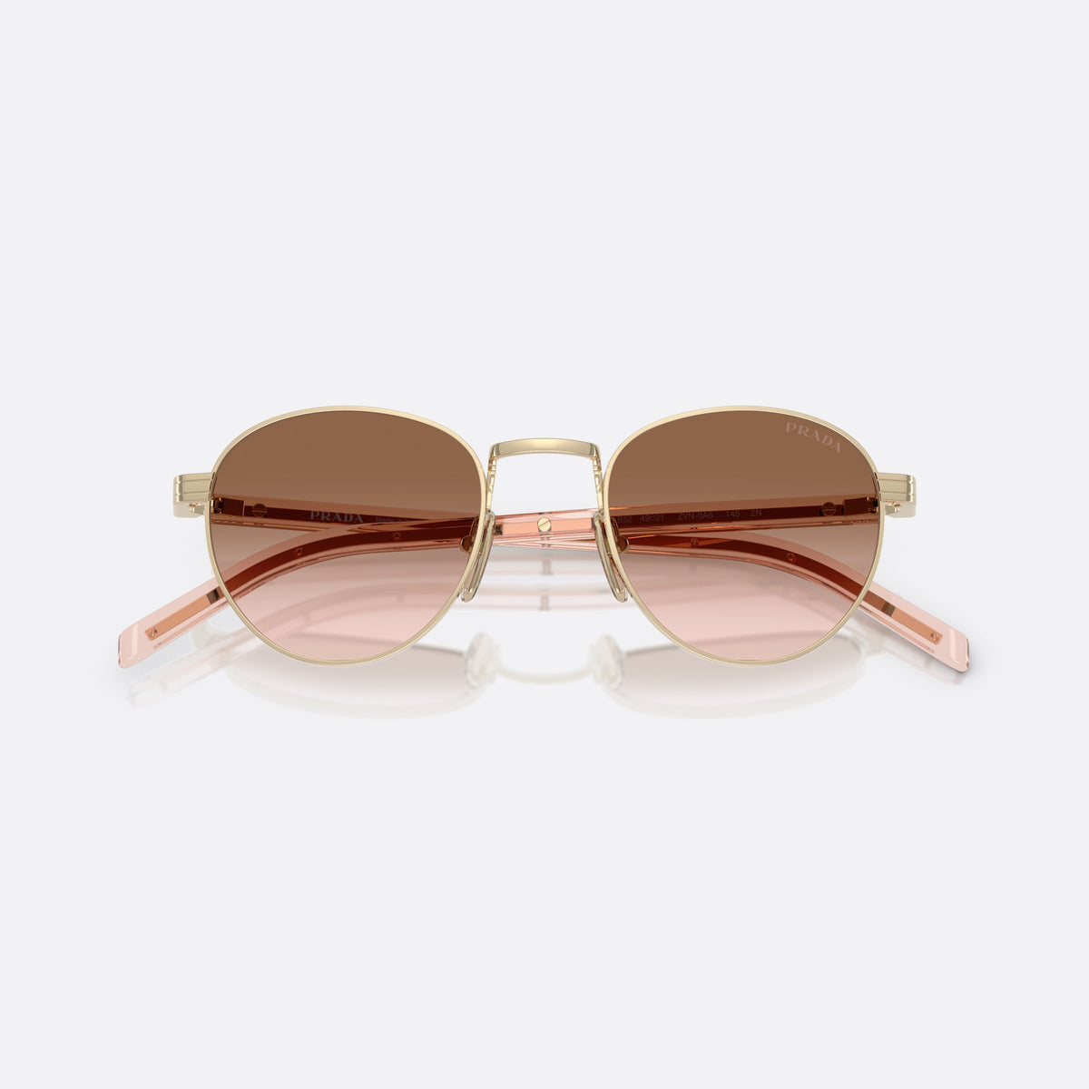 Prada PR B52S ZVN0A6 GLBW sunglasses, gold oval frame for women, plain metal bridge, brand lettering on temples, folded
