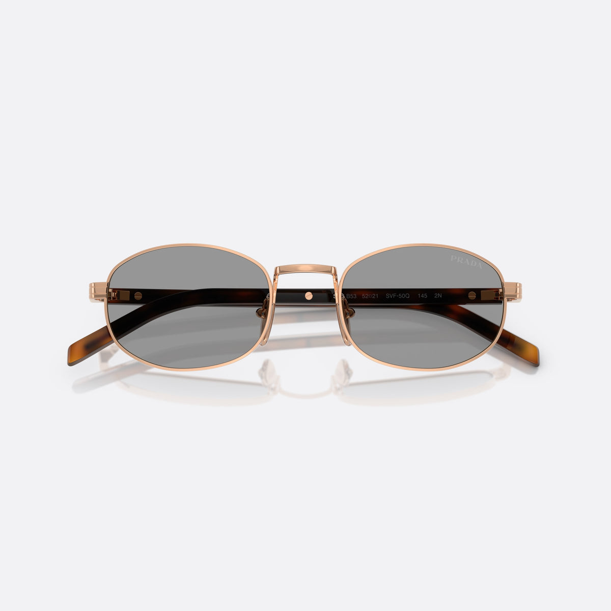 Ochelari de soare Prada PR B53S SVF50Q, ovali auriu, pentru femei, punte metalică simplă, litere ale brandului pe brațe, cu brațele pliate