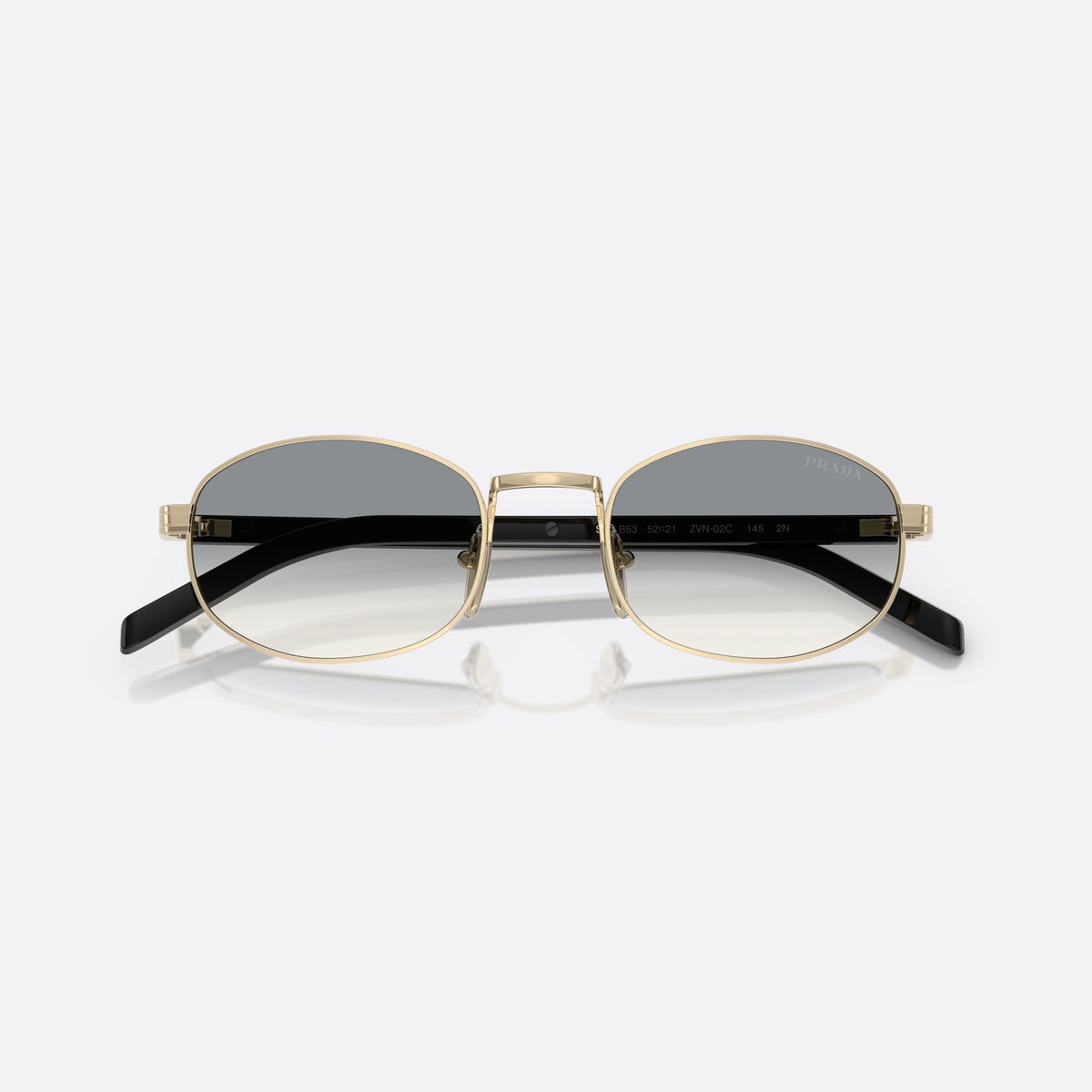 Ochelari de soare Prada PR B53S ZVN02C, ovali auriu, pentru femei, punte metalică simplă, literele brandului pe brațe, cu brațele pliate