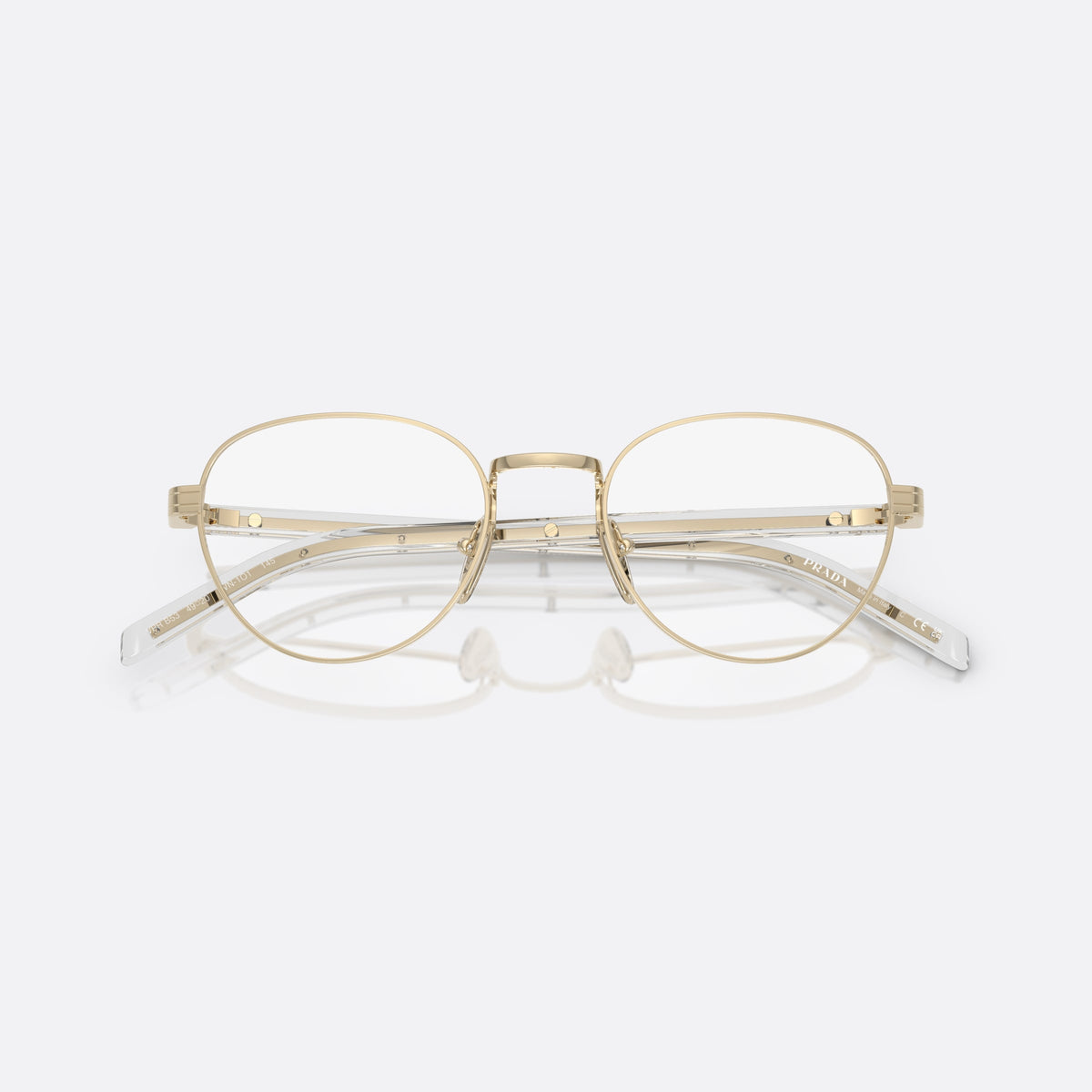 Prada PR B53V ZVN1O1 eyeglasses, gold round frame for women, plain metal bridge, brand lettering on the temples, folded