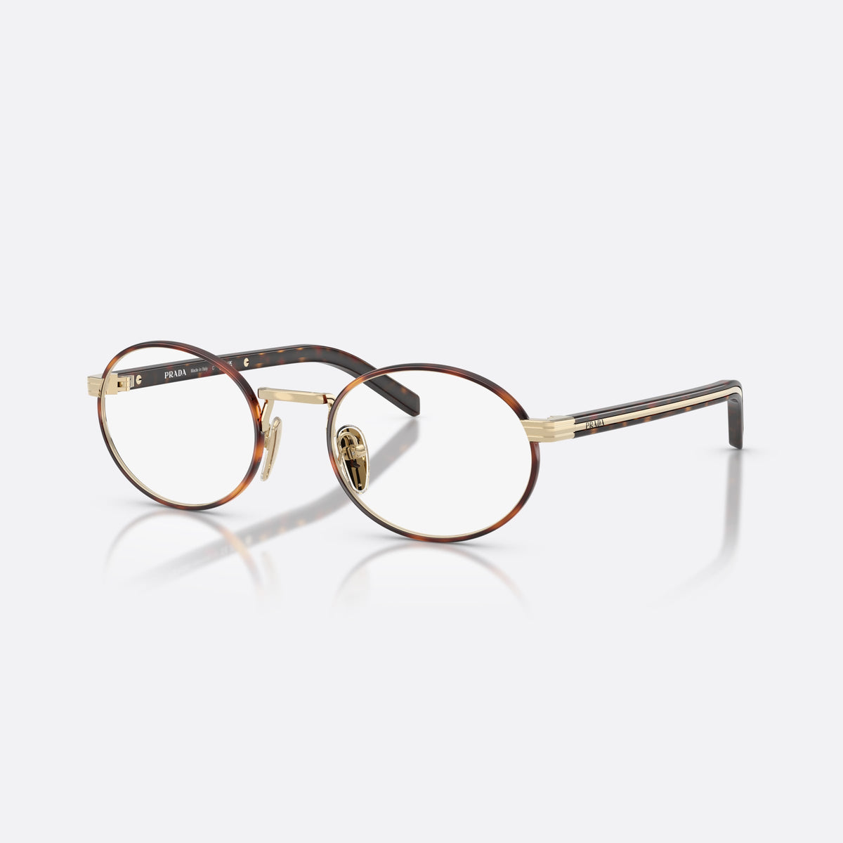 Prada PR B55V 21E1O1 eyeglasses, havana oval frame for women, saddle metal bridge, brand lettering on temples