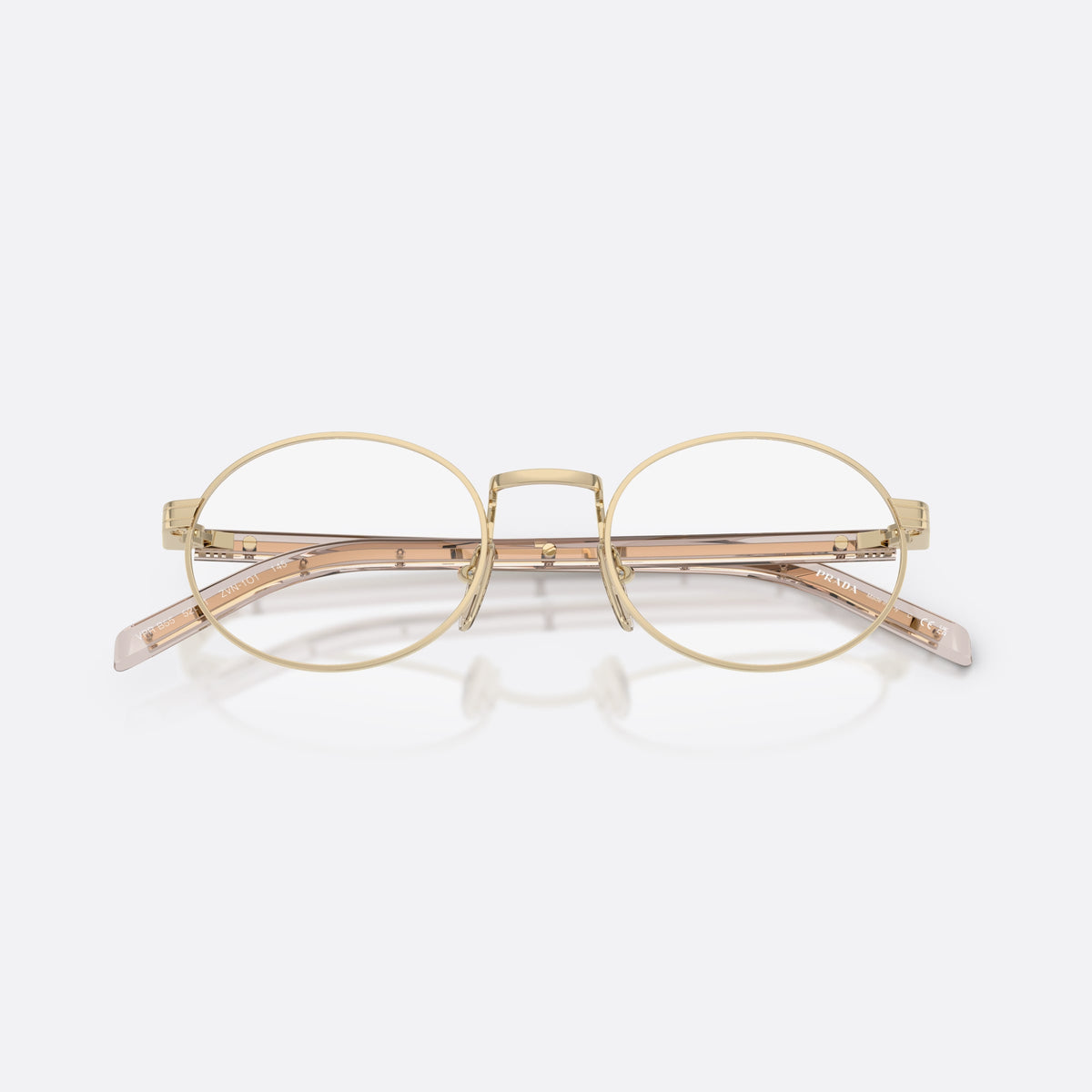 Prada PR B55V ZVN1O1 eyeglasses, gold oval frame for women, plain metal bridge, brand lettering on temples, folded