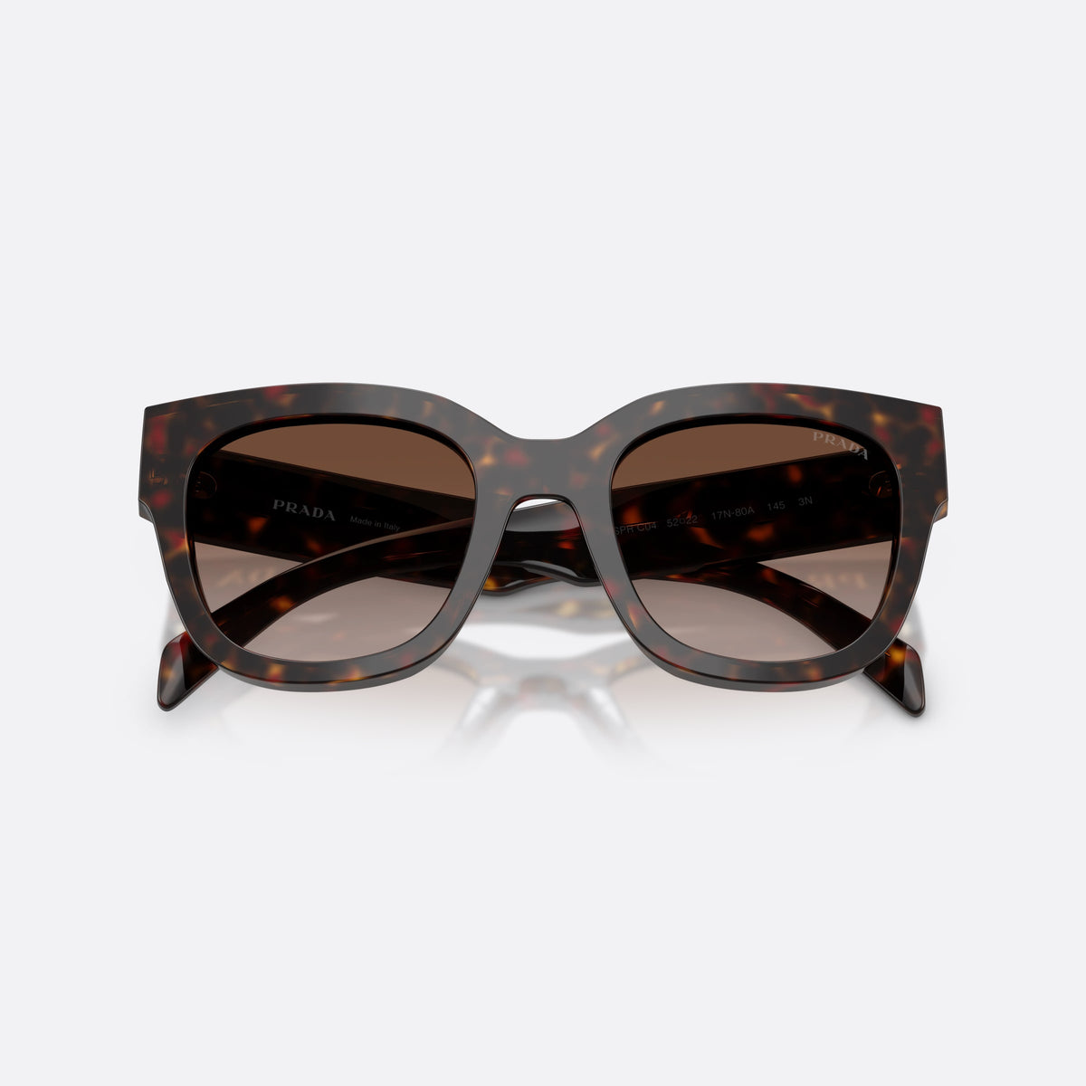 Prada PR C04S 17N80A sunglasses, havana square frame for women, plain integrated bridge, brand lettering on temples, folded