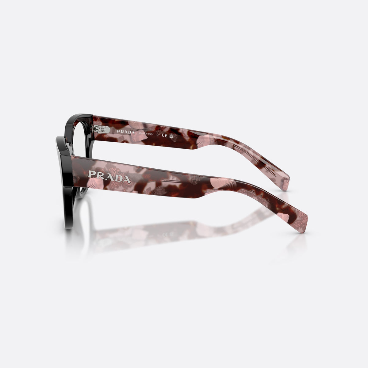 Prada PR C06V 28F1O1 eyeglasses, black oval frame for women, plain saddle bridge, brand lettering on temples, side view