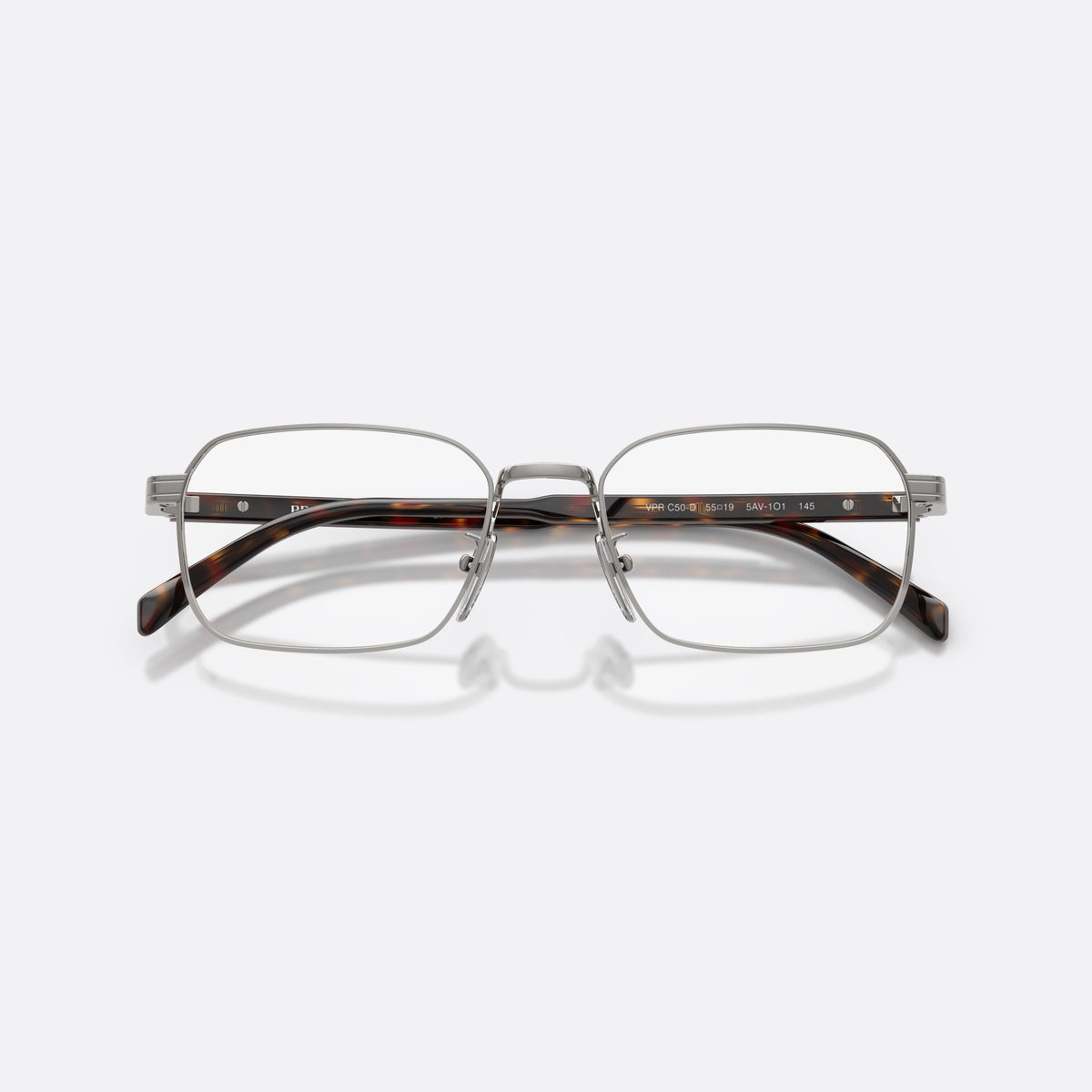 Prada PR C50VD 5AV1O1 eyeglasses, grey pillow frame for men, plain metal bridge, brand lettering on temples, folded