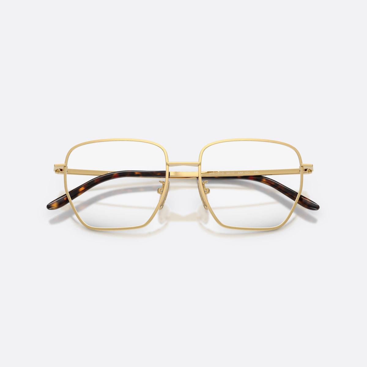 Prada PR C51VD 5AK1O1 eyeglasses, gold square frame for women, plain metal bridge, brand lettering on temples, folded