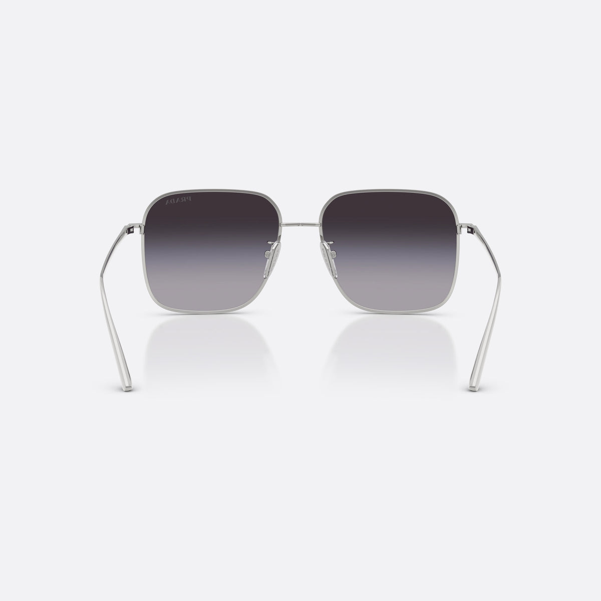Prada PR C54SD 1BC90A sunglasses, silver square frame for women, plain metal bridge, brand lettering on temples, back view